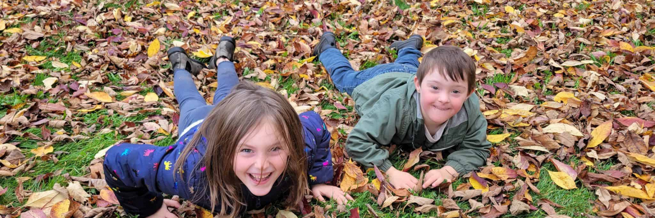 Contributors children playing in leaves