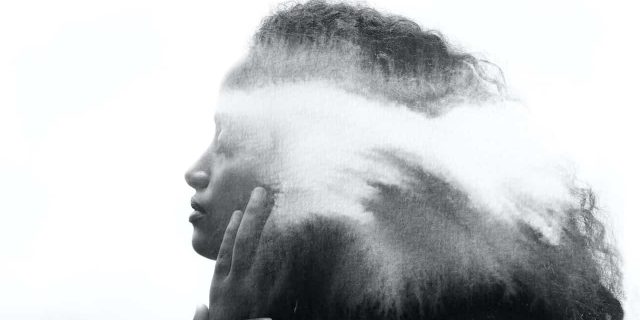 Paintography portrait of Black woman with eyes closed and clouds/fog drifting over her hair