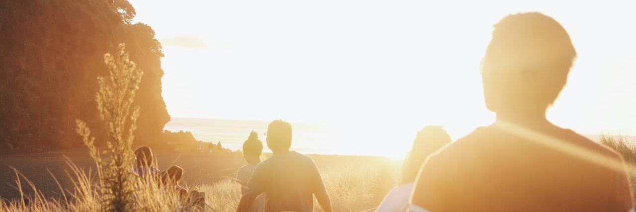 What I Learned After Being Abandoned by Friends During Tough Times Silhouette of friends walking on beach path at sunset