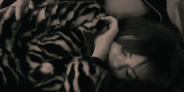 Selena Gomez laying down in "My Mind and Me" documentary