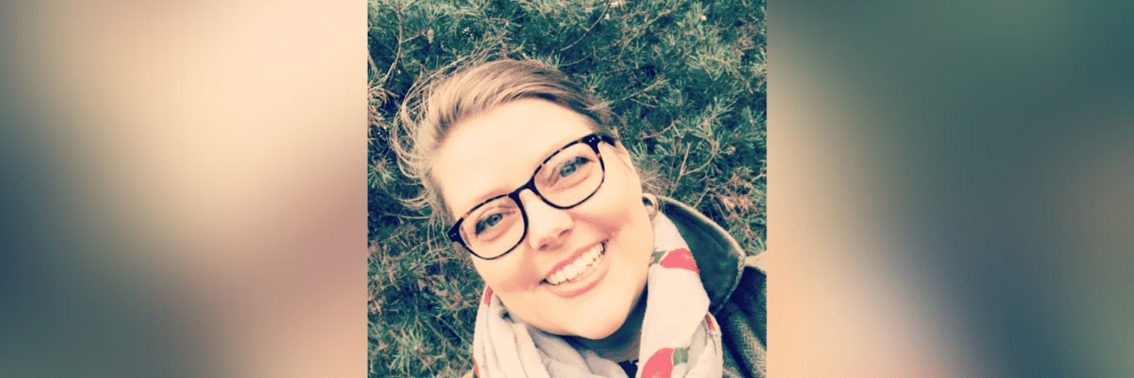 Realizing My Limits and Accepting the Isolation of Living With Disability Photo of contributor smiling in front of greenery