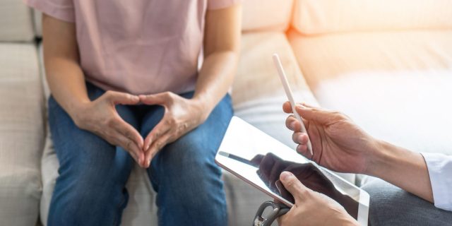 Resources for Cervical Health Awareness Month patient consulting with doctor in medical clinic or hospital