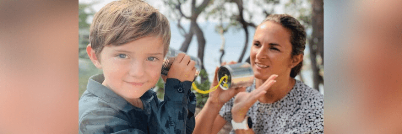 My Life With Aphasia After Brain Injury Contributor with her son, holding tin cans connected with string