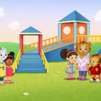 Characters from from "Daniel Tiger's Neighborhood" standing near the new ramp on the playground