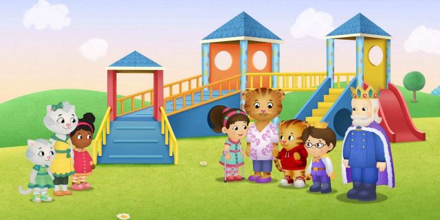 Characters from from "Daniel Tiger's Neighborhood" standing near the new ramp on the playground