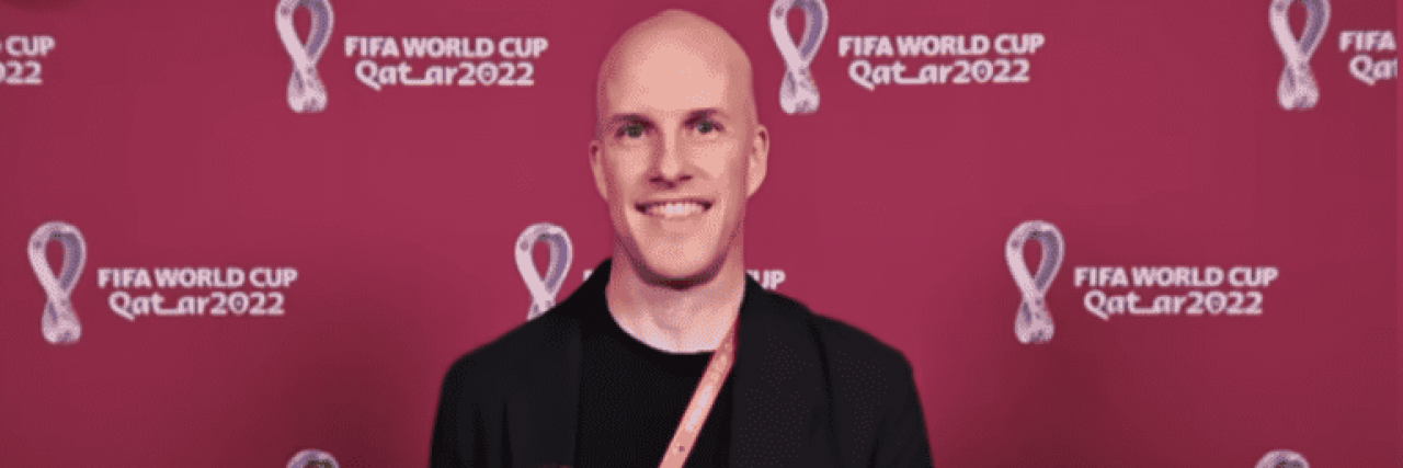 Grant Wahl in front of a red World Cup background