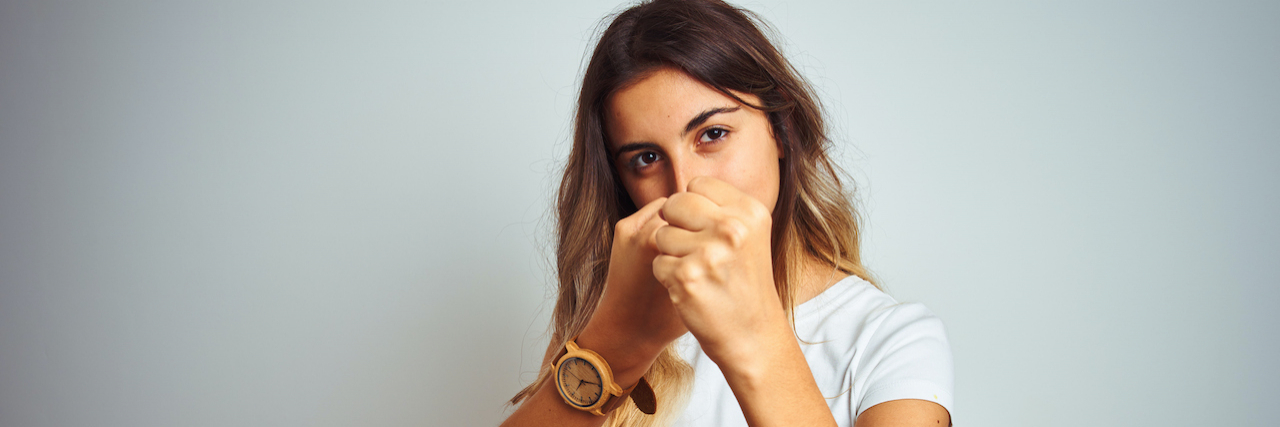 The First Rule of MS Club Woman with fists raised