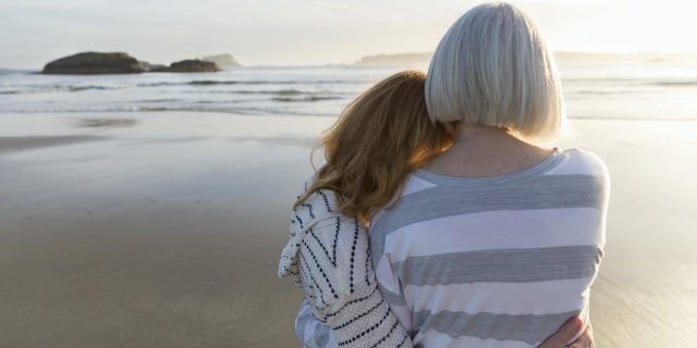 Making a Decision on Moving Our Grown Child to Residential Care Mother and grown daughter embracing on beach