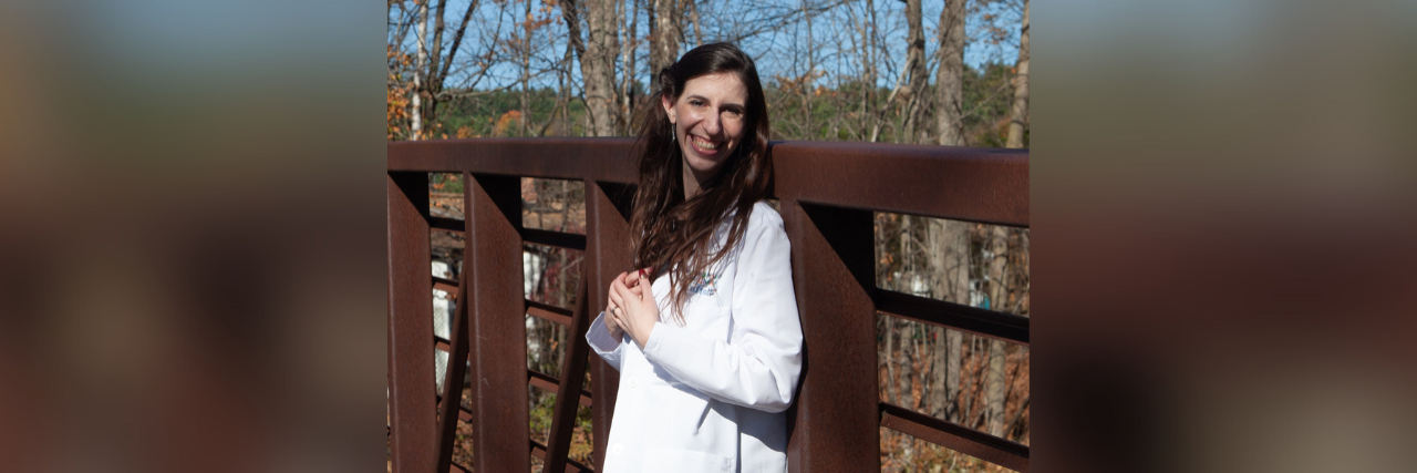 A Pediatrician's Take on the New Childhood Obesity Guidelines Photo of contributor standing a bridge outside wearing her white doctor's lab coat and smiling