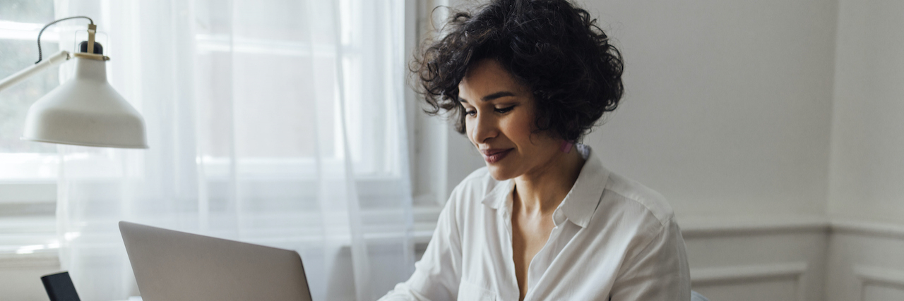 Beyond Dr. Google: How to Find Credible Medical Insights Online A woman of color typing on a computer