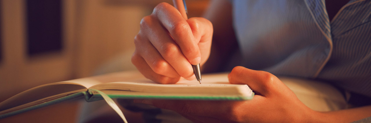 Why It Took Me 3 Years to Write About My Lupus Diagnosis Close up of woman making notes in a journal
