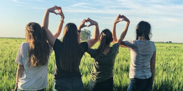 10 Tips for Finding an Ehlers-Danlos Patient Advocate  Women forming heart gestures in an open field