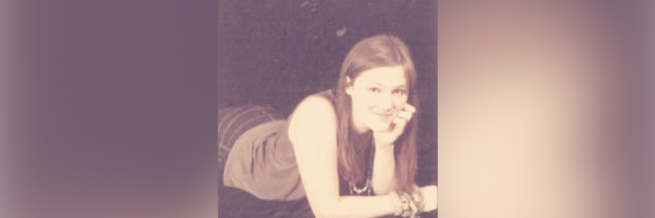 Remembering the Last of the Normal Days Photo of contributor as 18 year old, with hand on her chin smiling at the camera