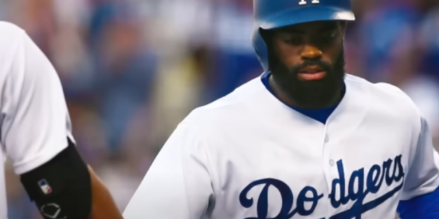 Dodgers player Andrew Toles in a game with batting helmet on