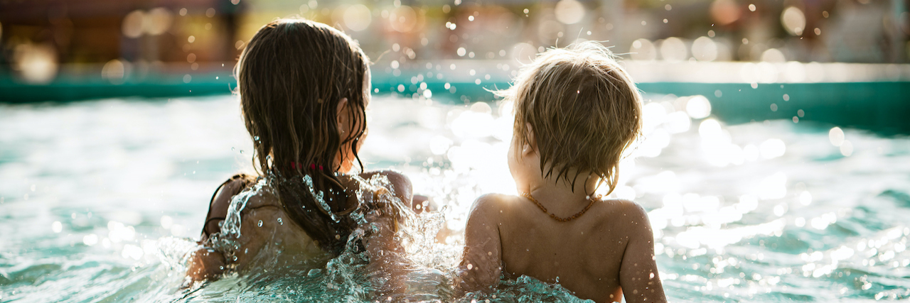 What a Stranger Said About My Child's G-Tube Rear view of young boy and girl splashing in a pool