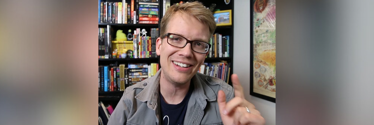Hank Green's Continued Impact on the Chronic Illness Community Photo of Hank Green in his office