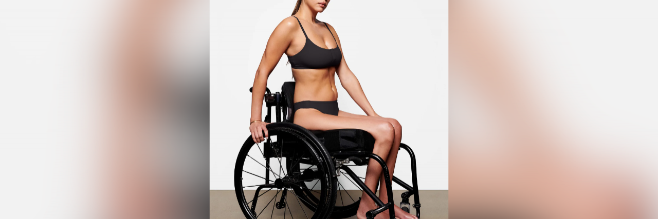 Model wearing adaptive bra and underwear sitting in a wheelchair