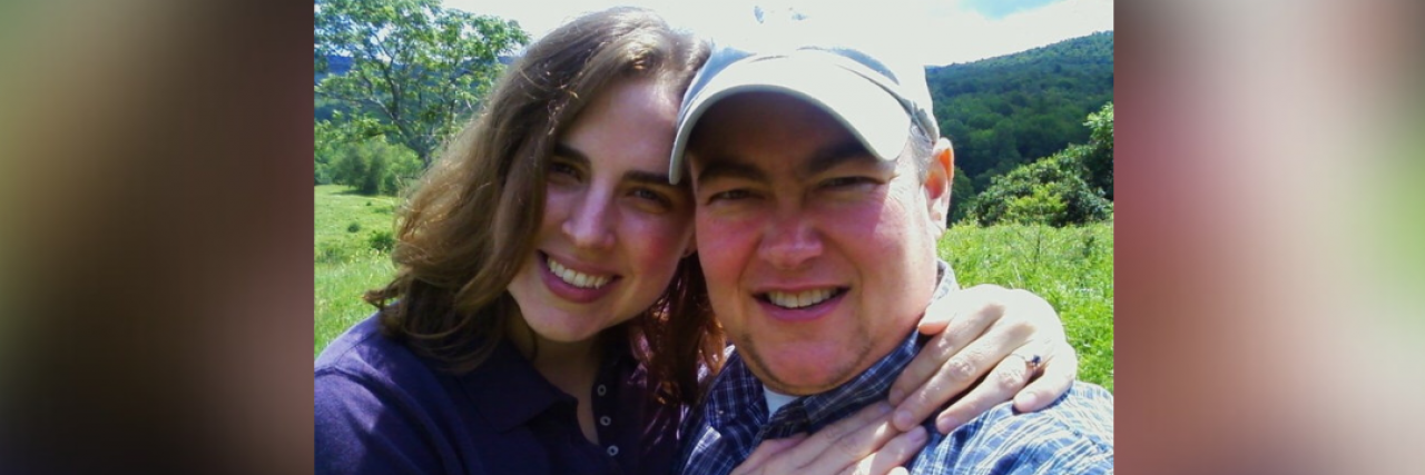 Contributor and her husband smiling with her arms around him