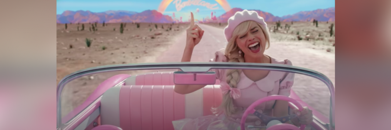 5 Unexpected Mental Health Lessons From the 'Barbie' Movie Image from "Barbie" movie of Barbie singing and driving away from Barbieland in pink convertible