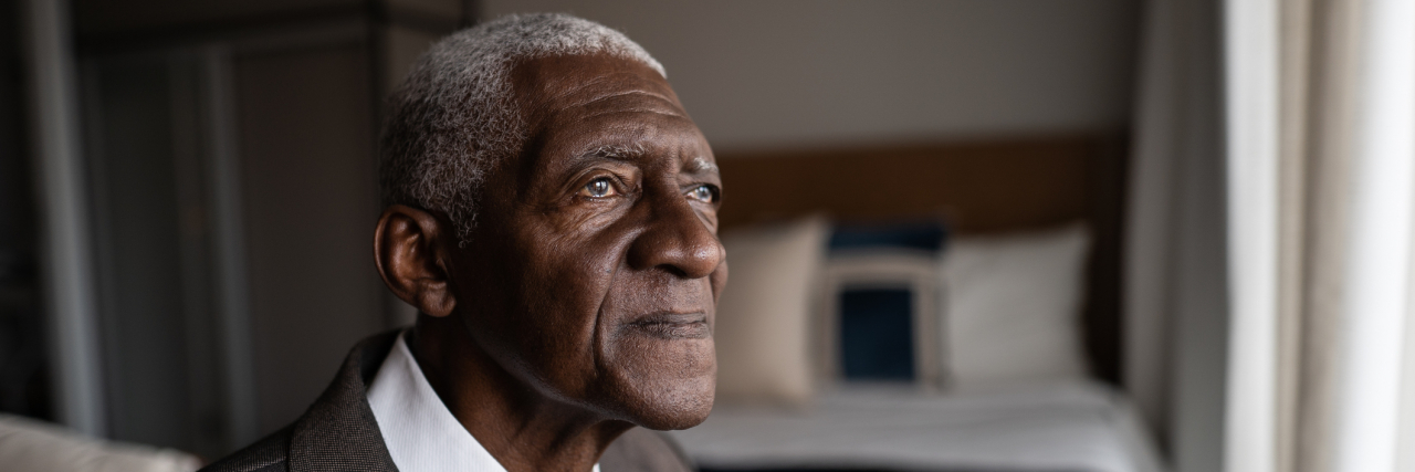 What Is Alzheimer's Disease: Types, Symptoms, and Risk Factors Contemplative senior Black man at home