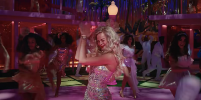 Barbie (played by Margot Robbie) clapping her hands in dance number from film