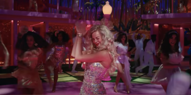 Why I Needed to See The "Barbie" Movie Twice Barbie (played by Margot Robbie) clapping her hands in dance number from film