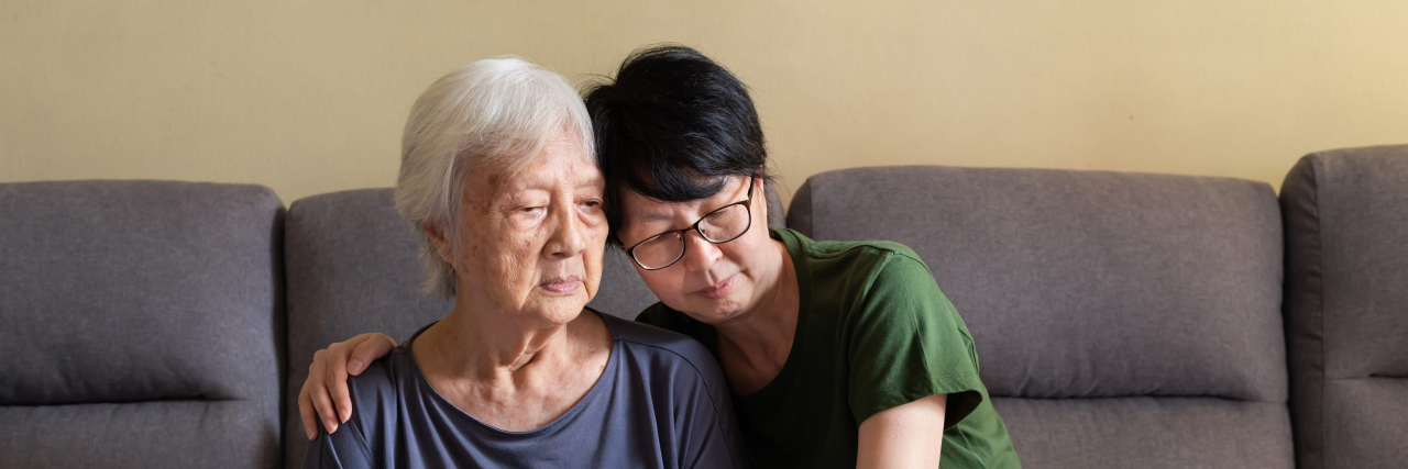 61 Unspoken Truths About Alzheimer's Woman spending quality time with her depressed elderly mother at home.