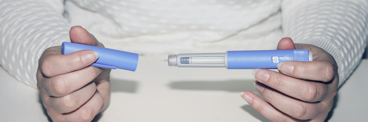 Is Off Label Weight Loss Medication Safe? Woman's hands holding an injection pen for diabetic.