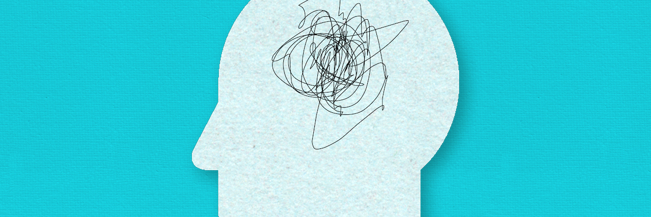 Illustration of paper head with scribbles in it