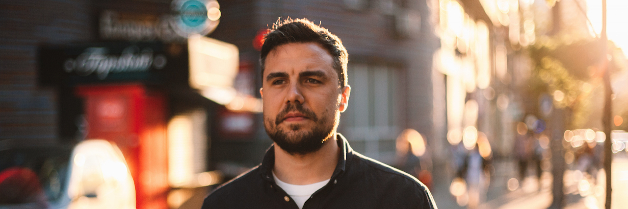 What Does Relapse Mean? Thoughtful man walking on street in city