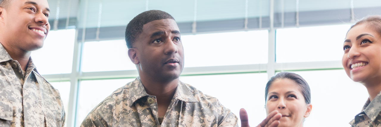 What You Should Know About Joining the Military With ADHD Military officer talks with diverse group of cadets