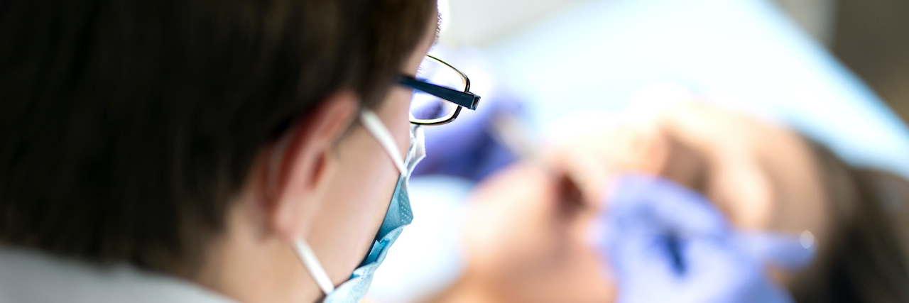 Can Wisdom Teeth Cause Migraine? Exploring the Link View from above of dentist working on patient