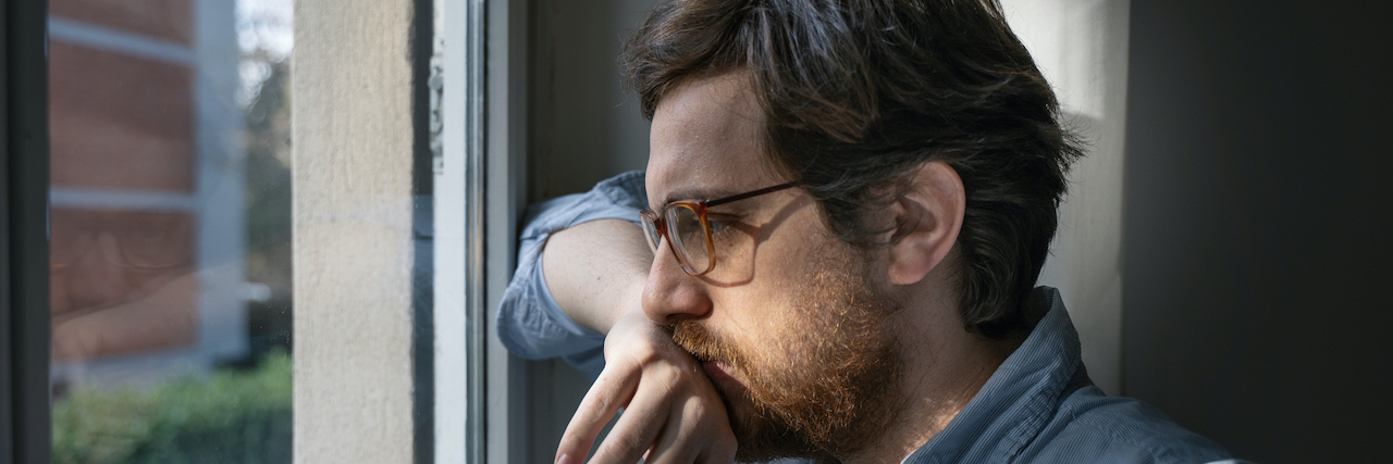 What Is Low Grade Depression Man looking out window