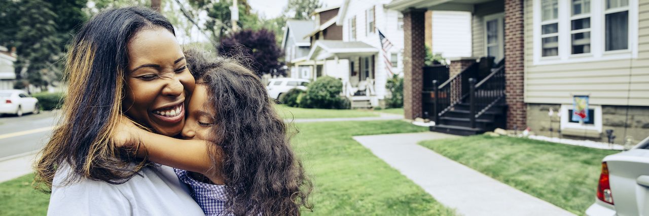Is Epilepsy Genetic? Understanding the Connection Young Black girl embracing mother in front yard