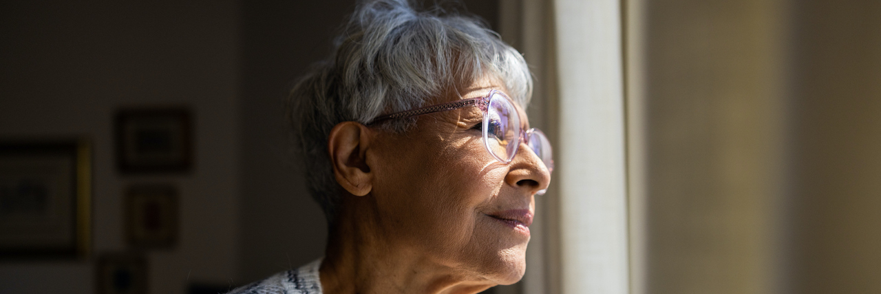 The Impact of Epilepsy on Life Expectancy Senior woman looking out a window