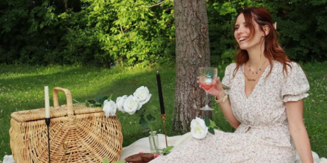 What Helped Me Most in My Bipolar Journey Contributor sitting on blanket outside holding a glass and having a picnic