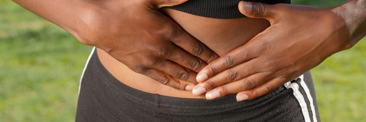 person with stomach cramp