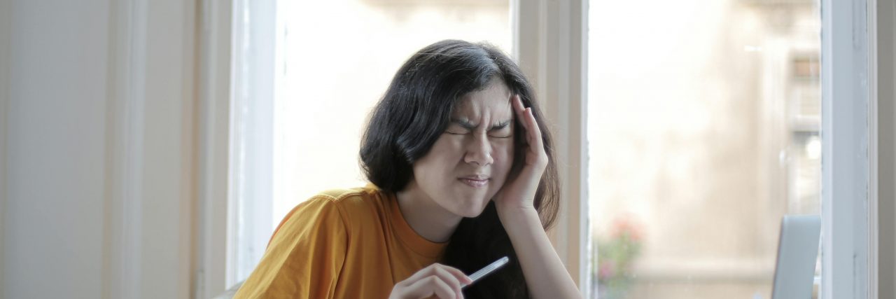 Woman with a migraine