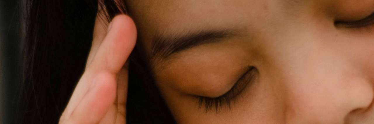 Central Sensitization and Hemicrania Continua person with chronic head pain