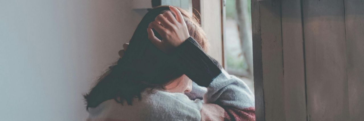 person looking out a window