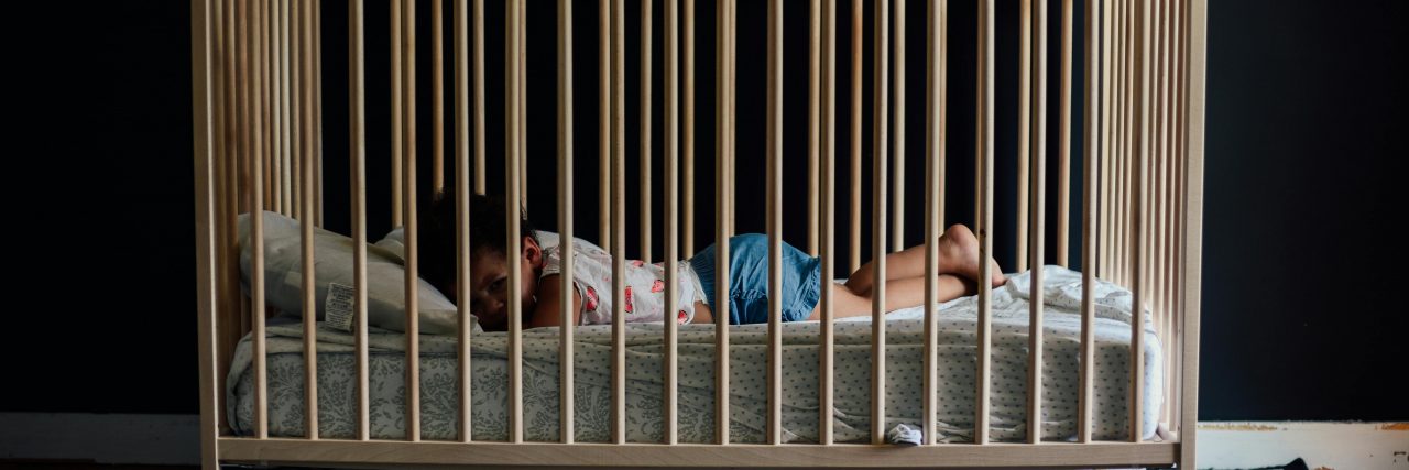 baby asleep in crib