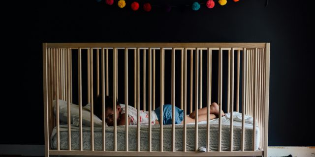 baby asleep in crib