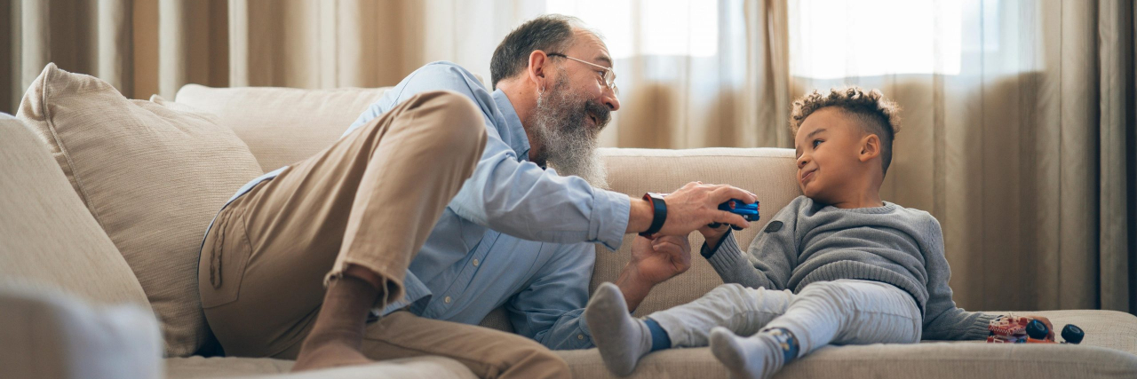 adult and child talking on the couch