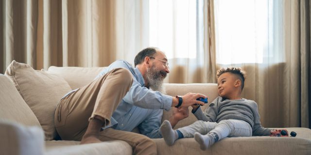 adult and child talking on the couch