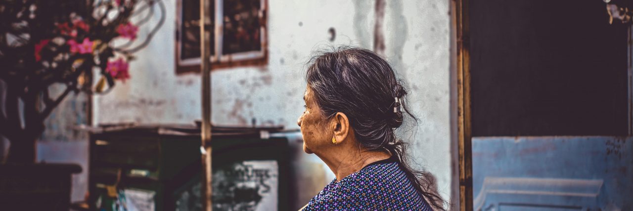 person sitting on a stoop