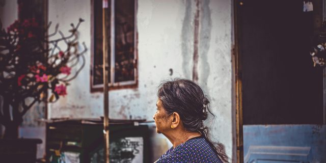 person sitting on a stoop
