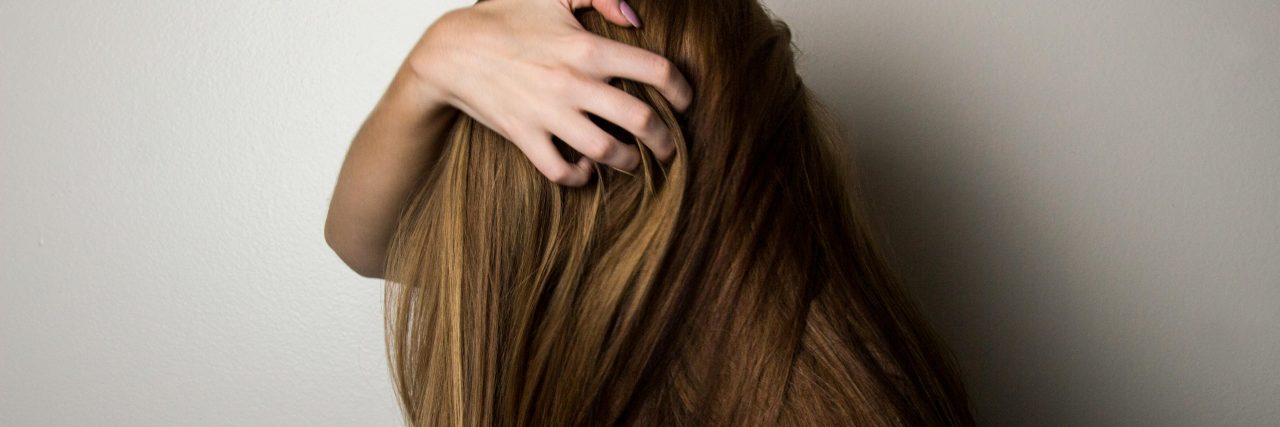 person pulling on hair