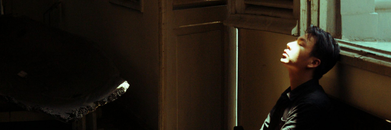 Signs of a Fearful-Avoidant Attachment Style man sitting alone