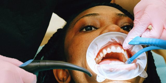 Does Ozempic Affect Your Teeth? Here's What To Know person at the dentist