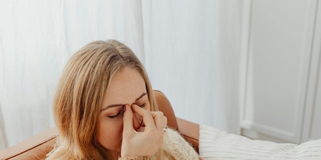 person with sinus headache